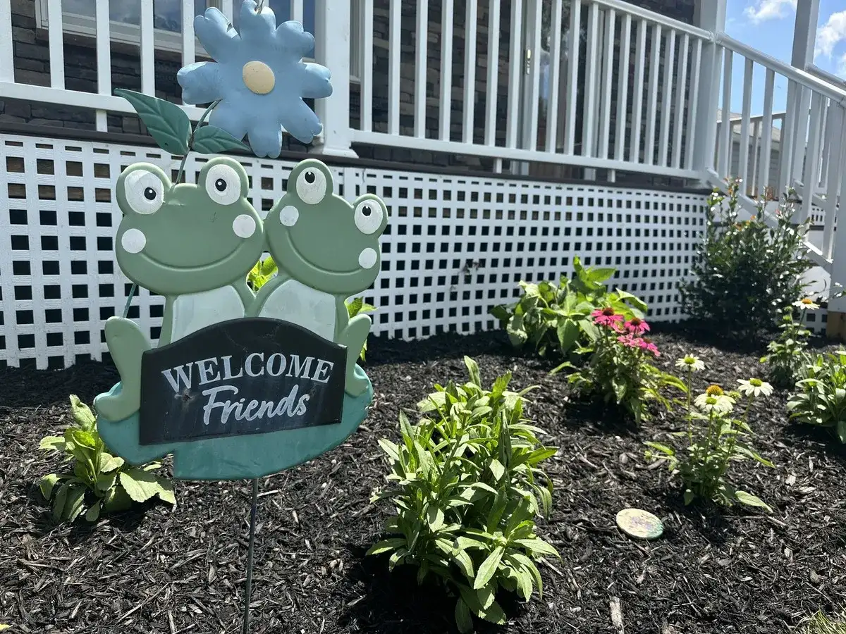 Planted flower bed with decorative accents in Annapolis
