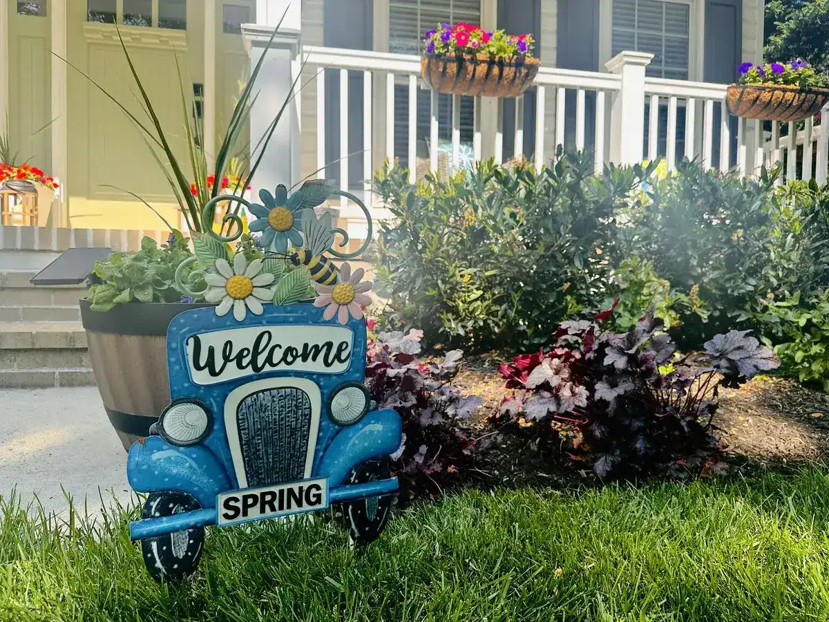 Welcome Spring porch display with plantings and hanging baskets in Annapolis